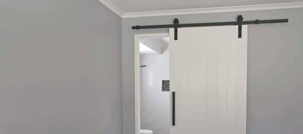 a sliding door in a bathroom